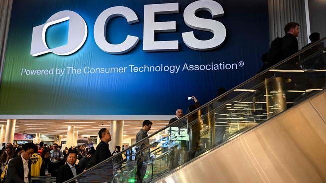 Attendees enter an exhibit hall during CES in Las Vegas, Nevada, on January 7, 2025. (Photo by Patrick T. Fallon / AFP)