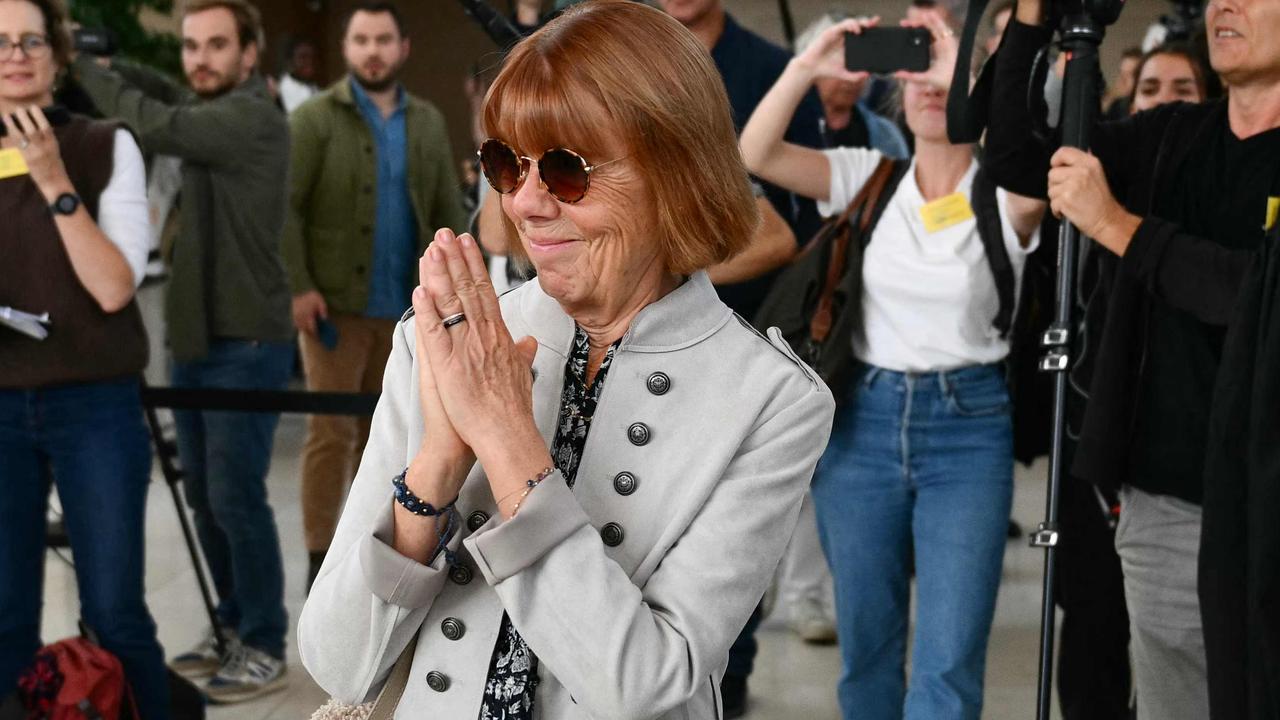 Gisele Pelicot acknowledges applause from onlookers after exiting court. Picture: Christophe Simon/AFP