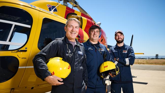 Pilot Dave Fiorito and Surf Life Savers Chris Parsons and Kane Butler at the Helistar base. Picture: Matt Loxton