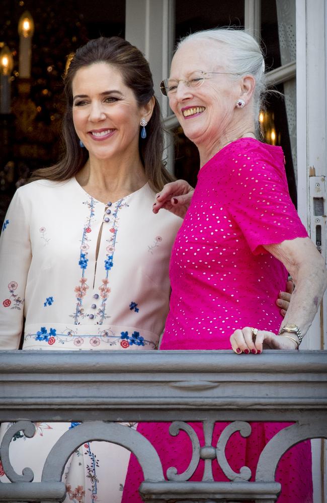 Queen Margrethe of Denmark and Crown Princess Mary share a moment. Picture: Patrick van Katwijk/Getty Images