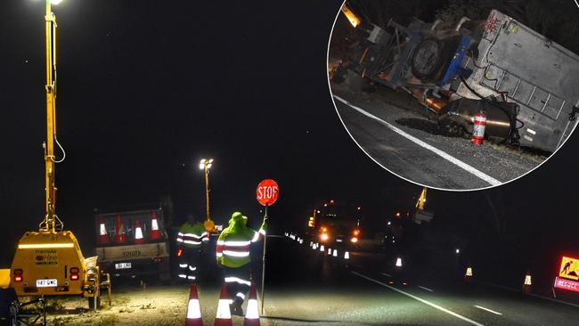 Truckie flees highway crash as toxic sludge leaks from truck