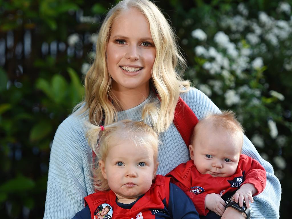 Ruby McDonald, wife of Melbourne forward Tom McDonald, with their two little children Bella and Leo. Picture: Josie Hayden.