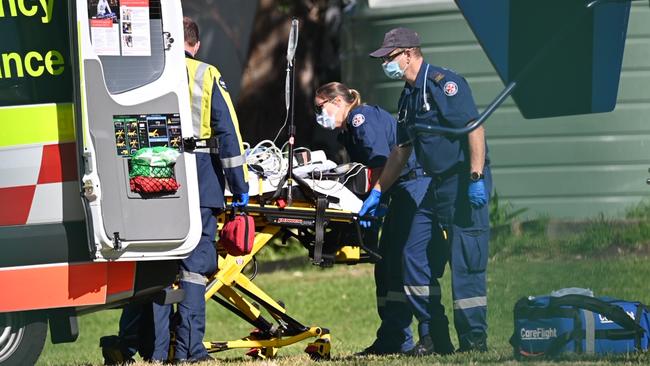 Paramedics treat a 9-year-old boy who had an accident at Mona Vale Public School. Picture: Seb Dekker.