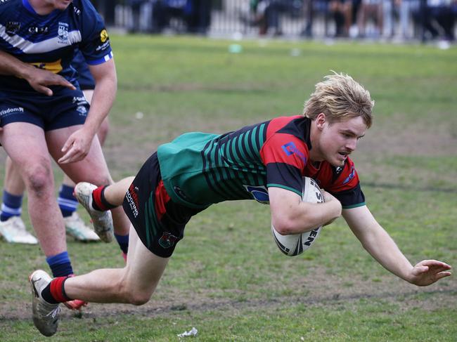 Colyton fullback Jesse Poulsen dives across for an early try. Photographer: Warren Gannon Photography