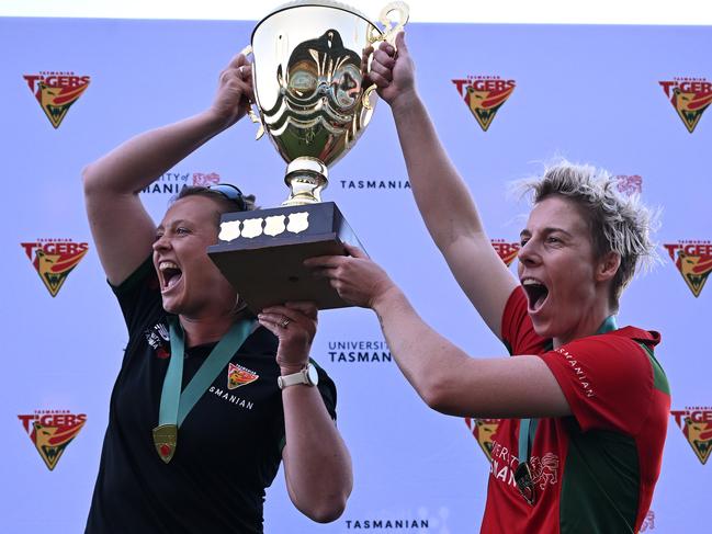 Salliann Beams, then coach of the Tigers, and captain Elyse Villani, raise the trophy after winning the WNCL final at Bellerive in 2022. Picture: Steve Bell/Getty Images