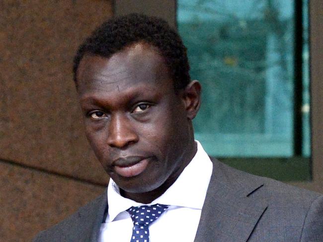 MELBOURNE, AUSTRALIA - NewsWire Photos JUNE 21, 2022: AFL footballer Majak Daw leaves the Melbourne Magistrates Court after receiving a fine for driving an unregistered vehicle. Picture: NCA NewsWire / Andrew Henshaw