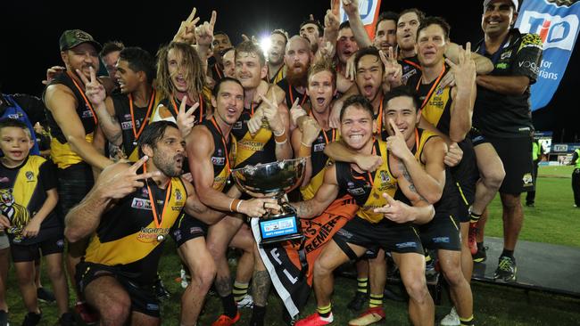 The Nightcliff Tigers celebrate their first back-to-back NTFL premierships after beating St Mary’s by 13 points in the 2019/20 NTFL Grand Final. Picture: GLENN CAMPBELL