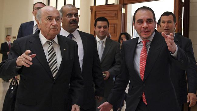 FILE - In this Monday, May 26, 2014.file photo Sepp Blatter, President of FIFA, left, is greeted by FIFA Vice President, Jordan's Prince Ali Bin al-Hussein, right, prior to their meeting on the first day of Blatter's regional tour to Jordan, the Palestinian territories and Israel, in Amman, Jordan. Ali Bin Al Hussein of Jordan will stand for election in a bid to oust Sepp Blatter as leader of football's scandal-hit world governing body. (AP Photo/Mohammad Hannon, File)