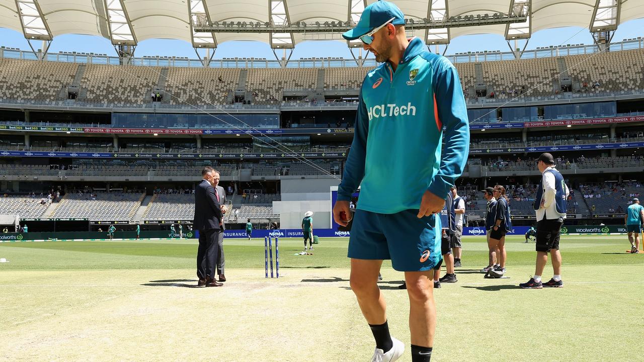 Nathan Lyon inspects what had been called a ‘dodgy wicket’ at Optus Stadium ahead of day four against Pakistan. Picture: Paul Kane/Getty Images.