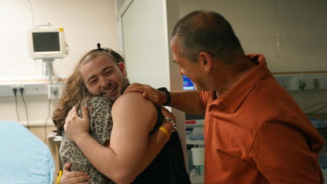 Almog Meir Jan, 22, being hugged at the Sheba Tel-HaShomer Medical Centre, after his rescue from the Gaza Strip by the Israeli army. Picture: AFP