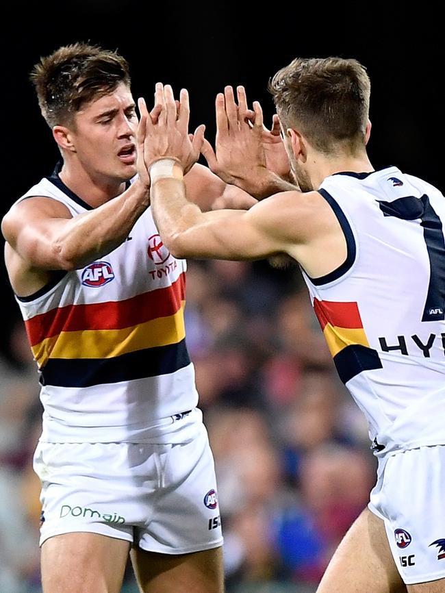 Crows Jordan Gallucci and Riley Knight celebrate a goal. Picture: Bradley Kanaris/Getty Images