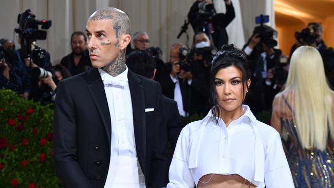 Kourtney Kardashian, right, has legally married Travis Barker. Picture: AFP