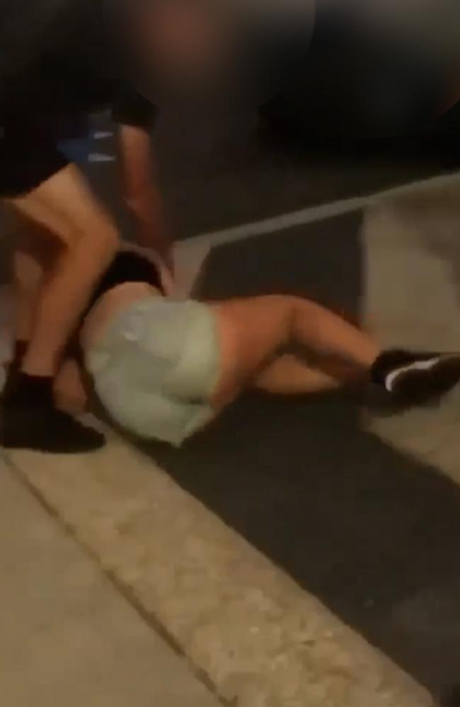 Images of a stranger stepping in to stop the attack on a girl in Wynnum's CBD.