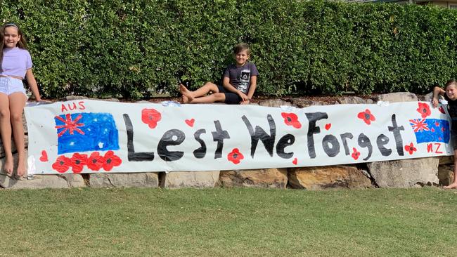 An Anzac Day banner made by my children instead of learning from home. Pictured left to right is Maddison, 12, Oliver, 8 and Hunter, 10. Both Australian and New Zealand flags are represented because they were born in Australia to New Zealand parents.