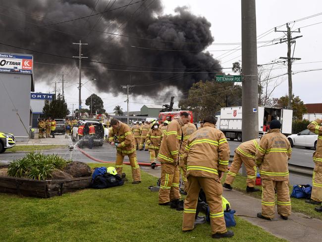 Firefighters prepare to battle the giant factory fire. Picture: William West/AFP