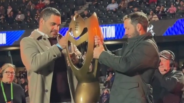 The Melbourne Storm show off their 2009 premiership trophy.