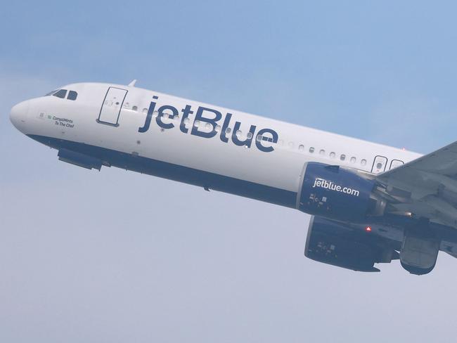 LOS ANGELES, CALIFORNIA - JANUARY 03: A JetBlue plane takes off from Los Angeles International Airport (LAX) on January 03, 2025 in Los Angeles, California. JetBlue has been fined $2 million by the Department of Transportation for âoperating multiple chronically delayed flightsâ which marks the first time an airline has received such a penalty.   Mario Tama/Getty Images/AFP (Photo by MARIO TAMA / GETTY IMAGES NORTH AMERICA / Getty Images via AFP)