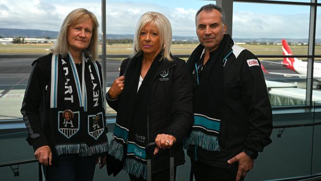 Kerry Coleman and Maggie and Marco D’Argenio at Adelaide Airport on Friday morning after QF734 to Sydney was cancelled. Picture: Naomi Jellicoe