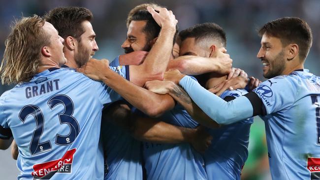 Sydney FC players celebrate Alex Brosque’s early goal.