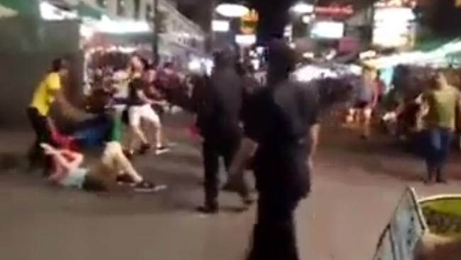 Locals move in to save the Brits from further punishment. Picture: YouTube/stickboynetwork.