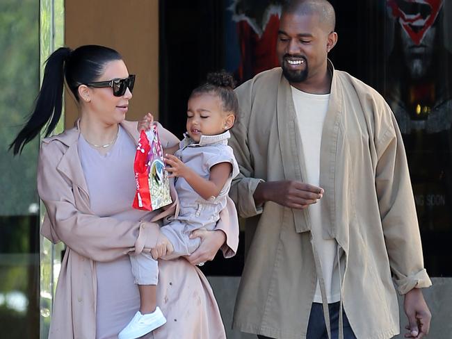 Kim Kardashian and Kanye West take baby North to the cinema to see Minions. Pictured: Kim Kardashian and Kanye West and baby North Ref: SPL1076095 120715 Picture by: Clint Brewer / Splash News Splash News and Pictures Los Angeles: 310-821-2666 New York: 212-619-2666 London: 870-934-2666 photodesk@splashnews.com