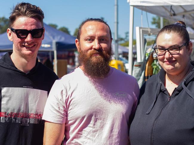 Blake Batten, Andrew Currie and Brooke Batten wandering the markets at the Moore Park Beach Arts Festival.