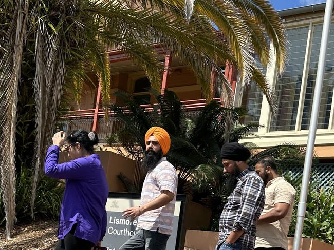 Lovepreet Singh, (in orange turban) with support leaving Lismore Courthouse. He remains on bail after pleading not guilty to the car crash death of a Lindendale farmer in January, 2022.