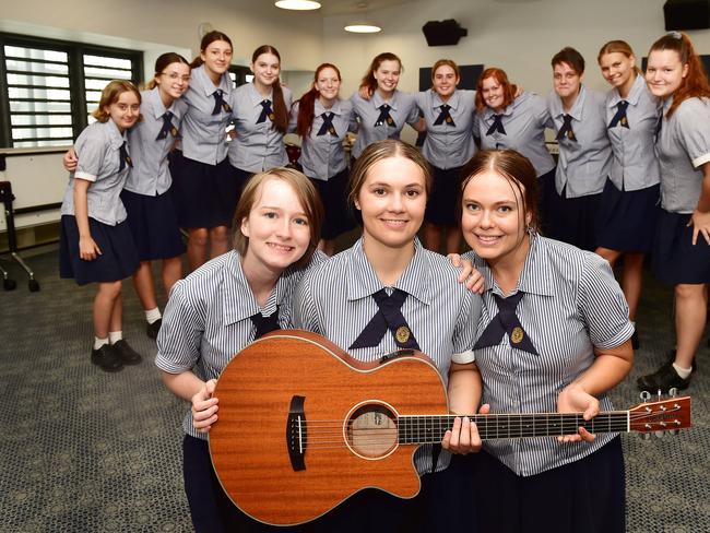 Charlotte Merritt, 16, Chloe Dickinson, 17, Molly Shaw, 16, with their friends in the new $19 million three-storey East Precinct building at St PatrickÃ•s College Townsville. Picture: Shae Beplate.