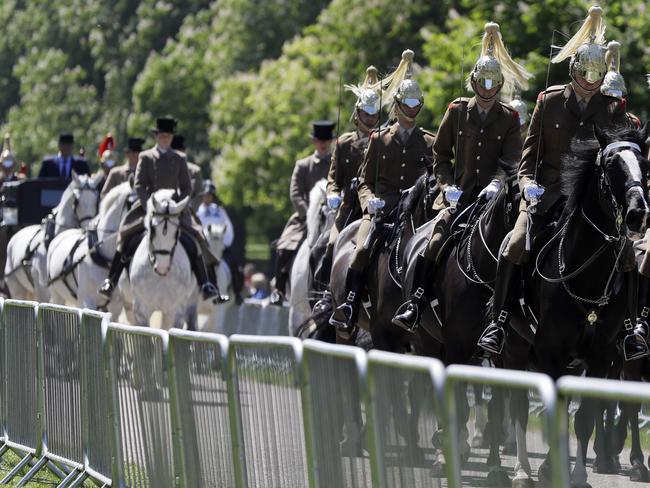 A carriage procession drives along The Long Walk during a rehearsal for The Royal Wedding in Windsor, England.