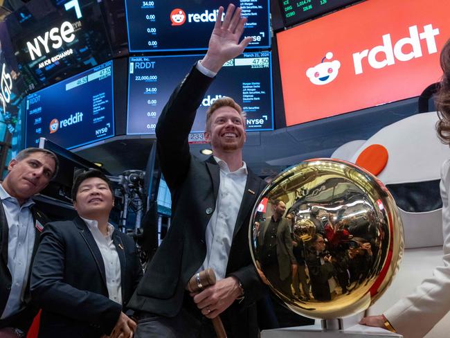 NEW YORK, NEW YORK - MARCH 21: Reddit CEO Steve Huffman stands on the floor of the New York Stock Exchange (NYSE) while ringing a bell on the floor setting the share price at $47 in its initial public offering (IPO) on March 21, 2024 in New York City. The social media platform Reddit had priced its IPO in the range of $31 to $34 per share on Wednesday.   Spencer Platt/Getty Images/AFP (Photo by SPENCER PLATT / GETTY IMAGES NORTH AMERICA / Getty Images via AFP)