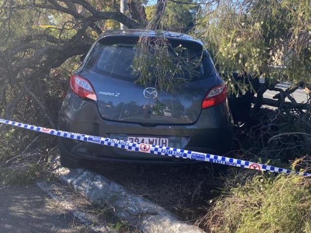 A teenage girl allegedly carjacked a woman at knifepoint, then slamming the stolen getaway car into a power pole at Mermaid Waters. Picture: Jordan Bissell/7News