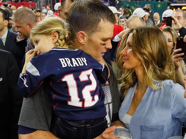 Brady, pictured holding his daughter, said his child did not deserve to be mocked, and is now questioning whether he’ll continue to call in to the station. Picture Getty