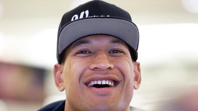 Waratahs fullback Israel Folau arrives home from South Africa at Sydney Airport.