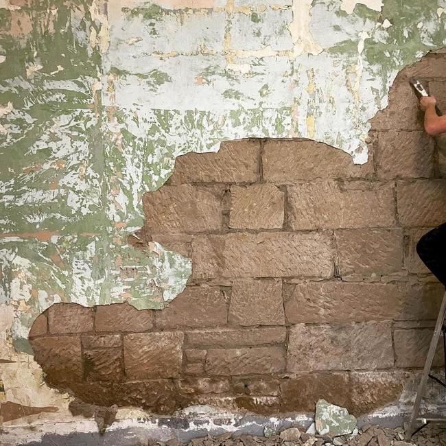 Discovering convict sandstone under crumbling 200-year-old render at an Oatlands property owned by Karen and Stu Miles which features on ABC TV series Grand Designs Transformations. Picture: Karen Miles/Instagram