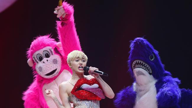 Miley and her fluffy animals ...  the pop superstar gets animated during her show in  London.