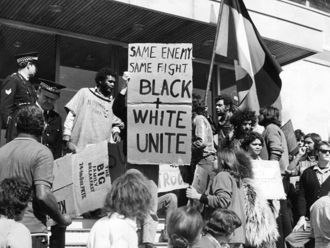 1972: Protesters climb the steps of the SA Police headquarters in Angas Street, Adelaide, in a demonstration against police brutality towards Aborigines. File picture