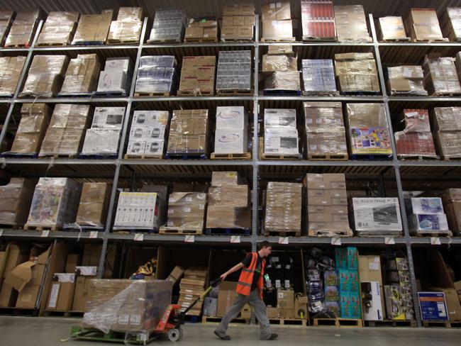 A worker in one of Amazon’s mammoth warehouses. Picture: Matt Cardy