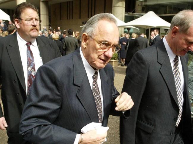 Funeral for racing identity and poultry king Jack Ingham..Jack's brother Bob (glasses) .pic Nathan Edwards...12/08/03