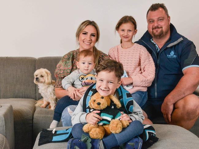 Young Xavier, pictured with his family, loves ‘superheroes, Port Adelaide’s Xavier Duursma and 7 NEWS’ weather reporter Amelia Mulcahy’. Picture: Brenton Edwards