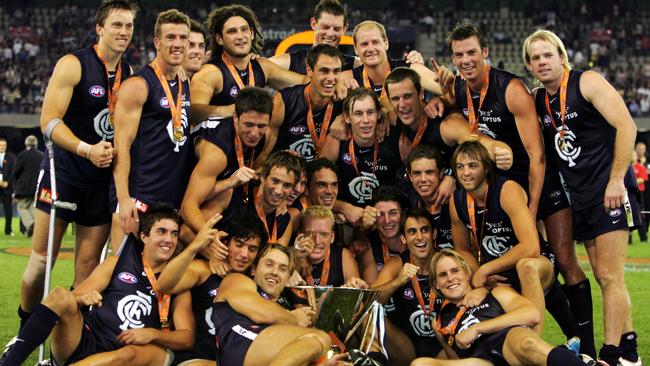 Carlton players celebrate after defeating West Coast in the 2005 Wizard Cup grand final.