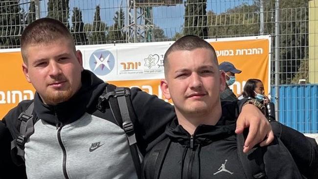 Din Tesler, 21, left, survived the terrorist massacre at an electronic dance music festival in Israel’s south last weekend. His friend, Bar Kuperstein, 21, was captured by Hamas.