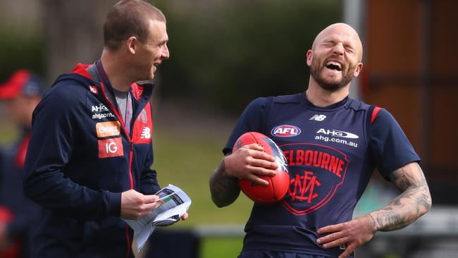 Simon Goodwin and Nathan Jones share a laugh. Picture: Michael Klein