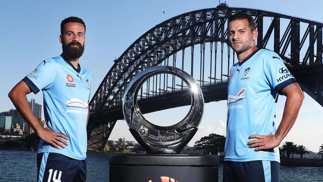Alex Brosque and Bobo with the Hyundai A-League trophy. Picture: Brett Costello