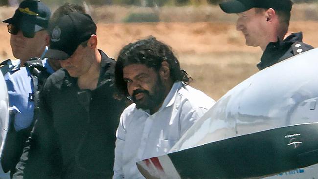 Terence Darrell Kelly is being taken to prison in Perth by SOG for alleged kidnapping of Cleo Smith, Carnarvon Airport. Picture: Colin Murty