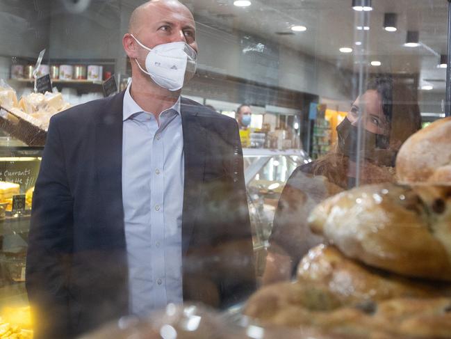 MELBOURNE, AUSTRALIA - NewsWire Photos - JANUARY 21 2022:  The Federal Treasurer, Josh Frydenberg visits Palamara Village Fruits in Mt Eliza. Picture: He is pictured with Sharon Coombes, Liberal, Candidate for Coombes (right). NCA NewsWire/Sarah Matray