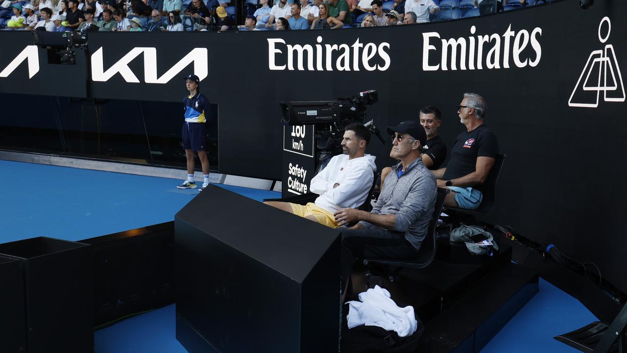 Jannik Sinner’s team, including Aussie coach Darren Cahill, sit inside the world number one’s coaches pod on Rod Laver Arena. Picture: Michael Klein.