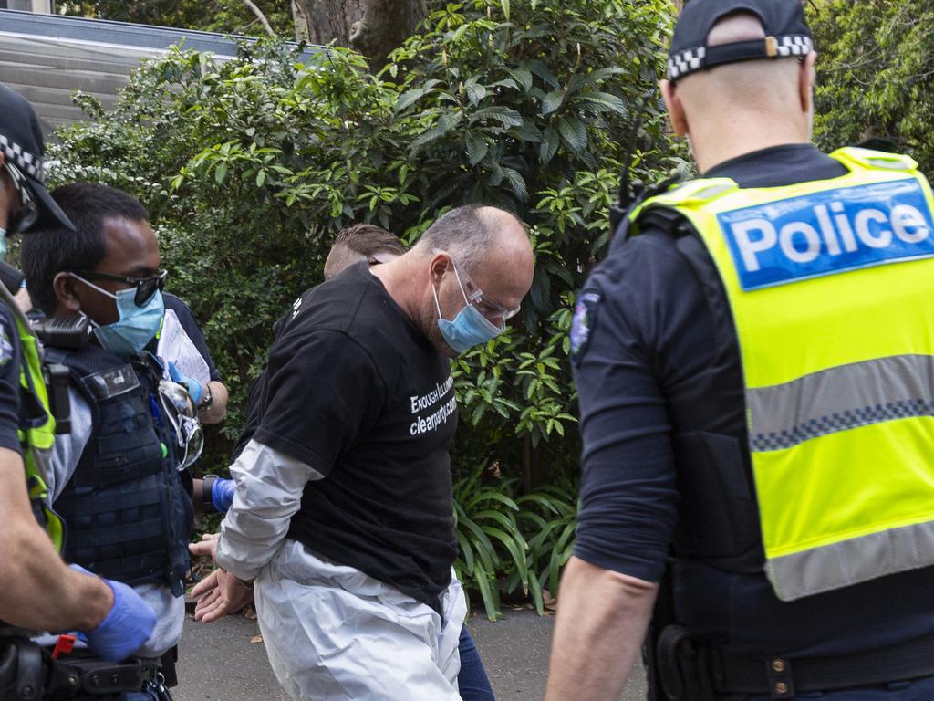 A man in handcuffs at the protest on Saturday. Picture: Daniel Pockett