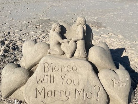 SOCIAL MEDIA IMAGE DISCUSS USE WITH YOUR EDITOR - ROMANTIC: Someone has created a romantic proposal at Belongil Beach.