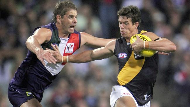 Troy Simmonds fends off Aaron Sandilands. Picture: Jackson Flindell