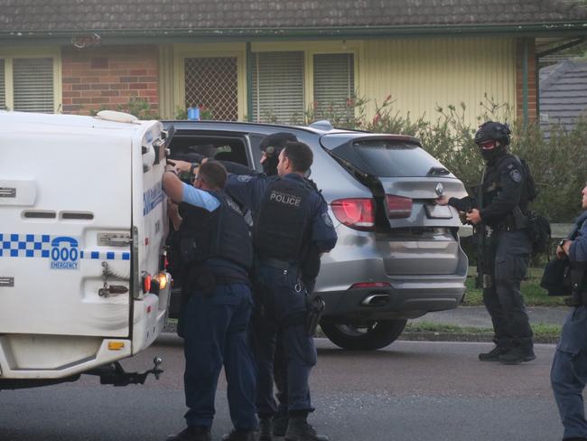 Police and heavily armed tactical officers swarmed Mr White’s unit in Cutler Ave, Wyong. Picture: Richard Noone